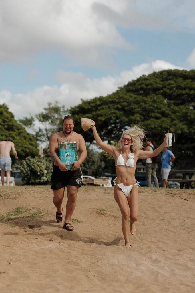 bride and groom celebrating wedding day at the beach in oahu