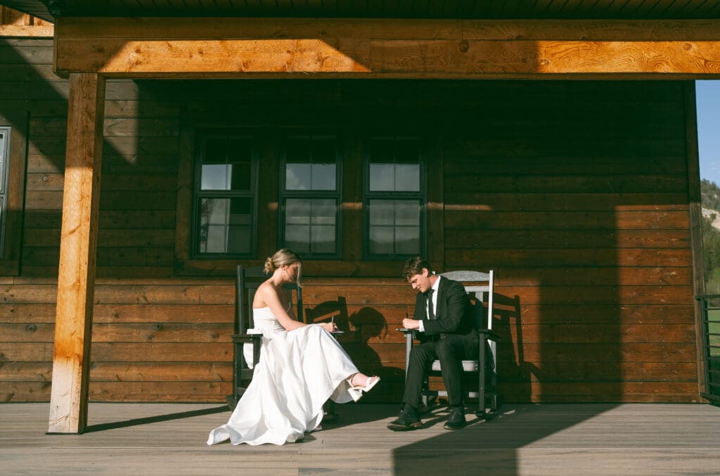 bride and groom writing vows for wedding in jackson hole horse ranch